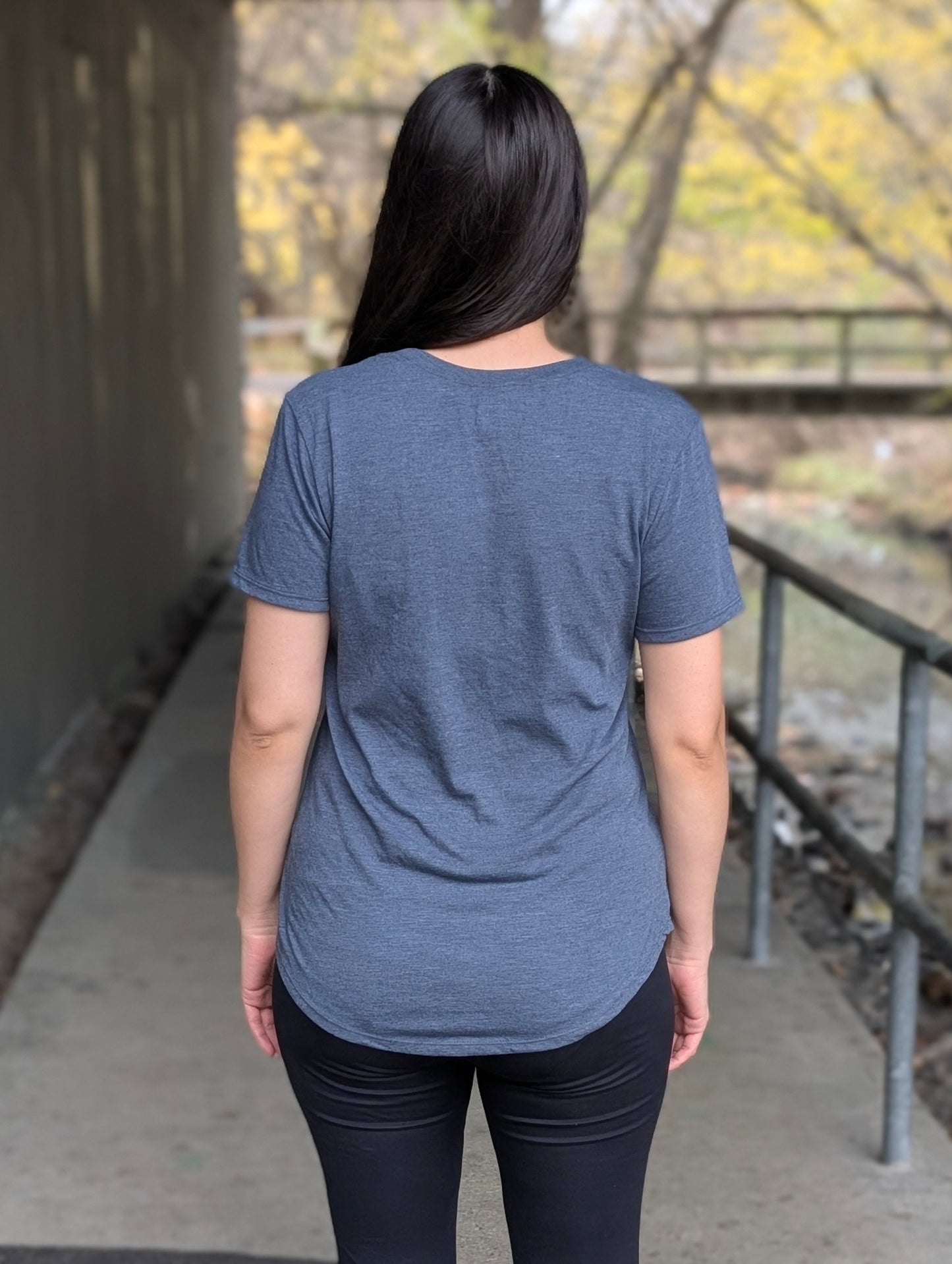 Back view of a women's scoop hem t-shirt